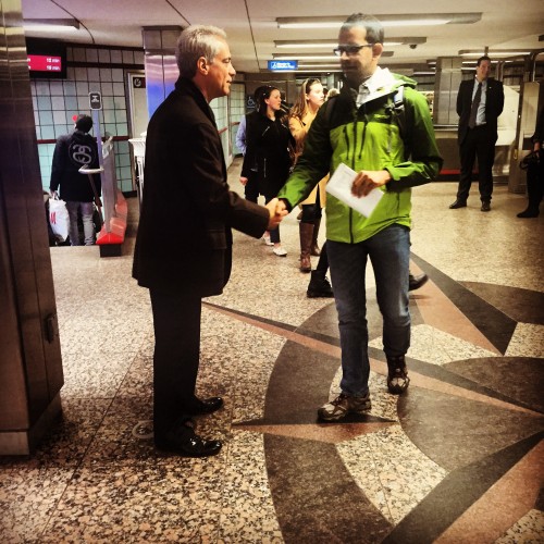 Mayor Rahm Emanuel shakes hands with Chicago resident at Grand Red Line stop days before run-off  election in April. 