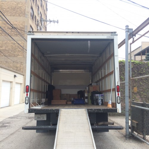Loading  the truck, stopping at four apartments throughout Chicago.