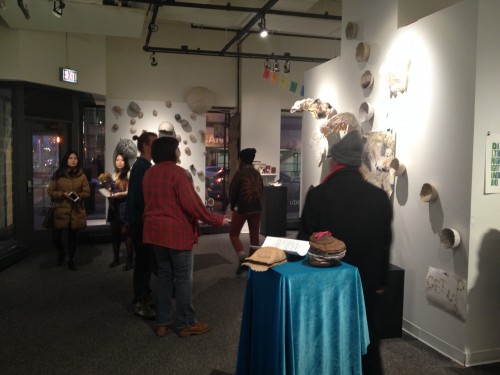 Visitors explore the work of Book, Paper, and Print Students at C33 Gallery.