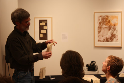 Tim Barrett showing one of his soft sculpture artist books.